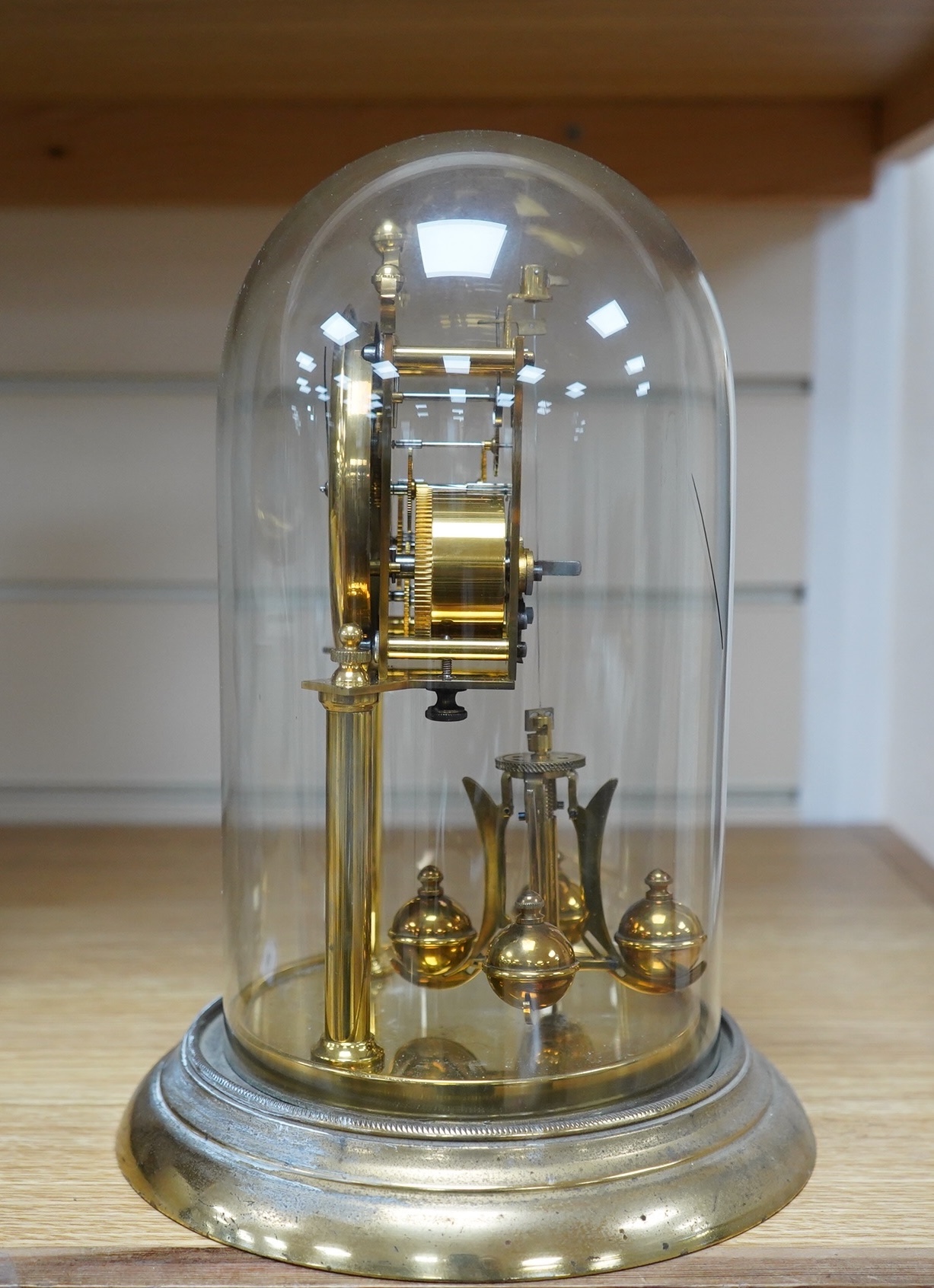 A late 19th century German 400 day torsion clock under dome, 26cm. Condition - fair to good. Not tested
